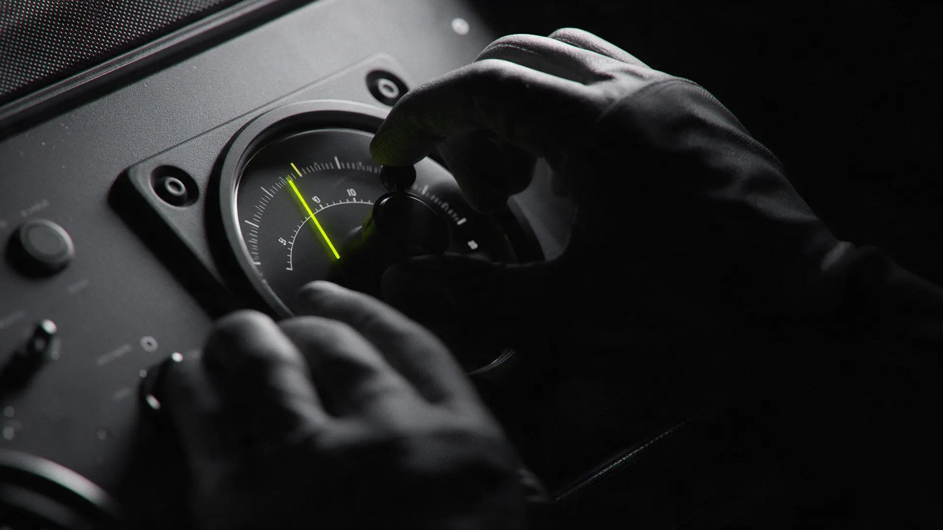 A hand turning a dial with a lime needle